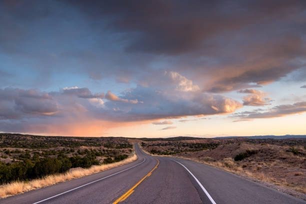 Open highway in Portales, New Mexico, with sunset sky. Get more traffic with the help of a reliable SEO Company.