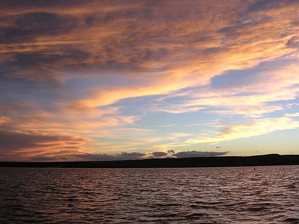 Sunset over a calm lake near Artesia, New Mexico. A Web Design Company can create a website as serene as this landscape.