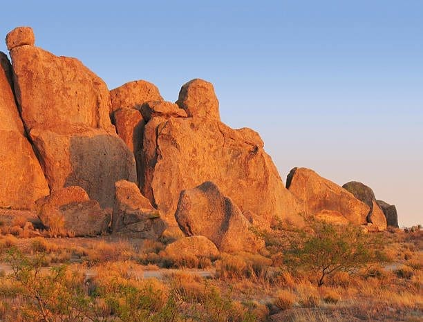 Large, imposing rock formations in a desert landscape outside Deming where WSI Web Enhancers serves as an SEO company