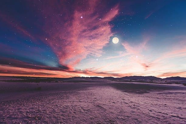 Night sky in Portales, New Mexico, with a full moon. Let our Web Development Company bring your website to life.