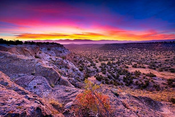 Stunning sunset in Española, New Mexico, with vivid hues. Let our SEO Company improve your search engine rankings today.
