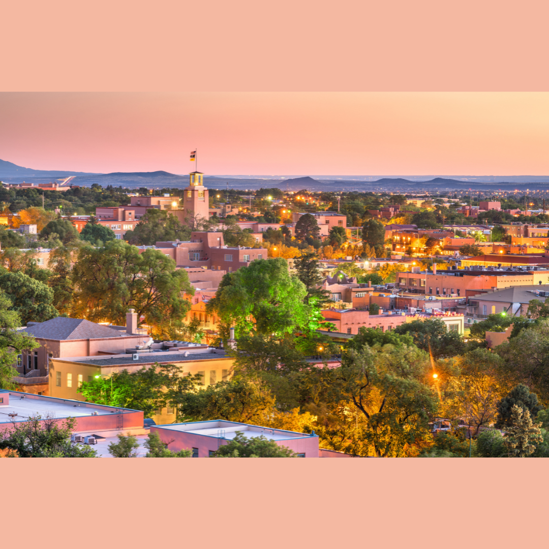 long horizon landscape of Santa Fe New Mexico at sunset, the whole picture is bright pink