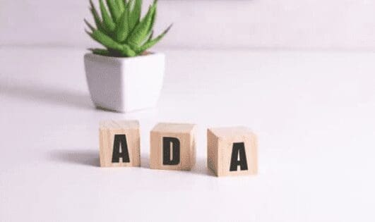 3 letter blocks that spell ADA on a white backdrop