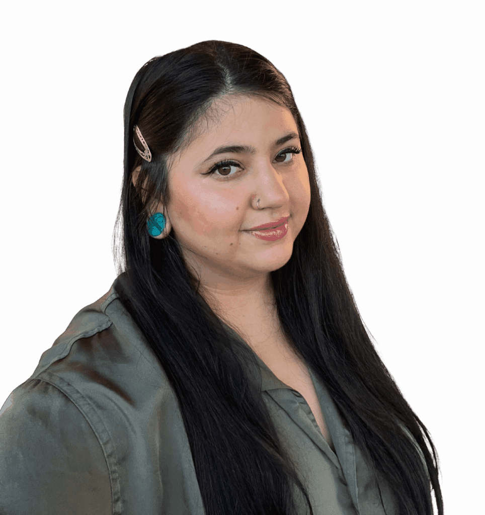 LeeAnna, a woman with long black hair is wearing a dark green shirt and turquoise earrings.